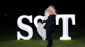 bride and groom photography in front of LED Sign