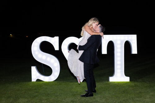 bride and groom photography in front of LED Sign
